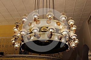 A large vintage chandelier hangs from the ceiling.