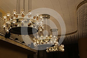 A large vintage chandelier hangs from the ceiling.