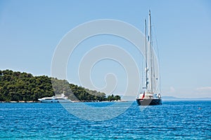 Large vintage yacht in front of Panormos beach at morning, Panormos bay, Skopelos island