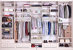 Large wardrobe with different clothes, home