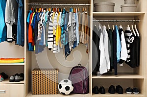 Large wardrobe with teenager clothes, shoes