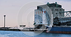 Large warehouse is docked alongside a pier in Japan, Hokkaido