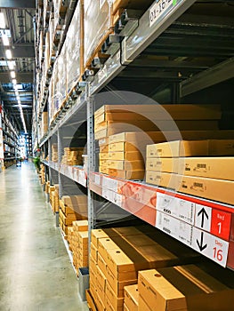 Large warehouse with long racks filled with packaged goods