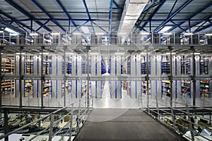 Large warehouse with numerous shelves with goods - photo