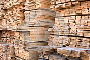 A large warehouse of wooden boards of various sizes for construction