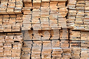 A large warehouse of wooden boards of various sizes for construction