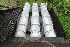 Large water pipe in a sewage treatment plant, with digestion tan