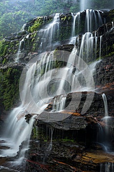 Large waterfall cascading down rocks in Blue Mountains Australia