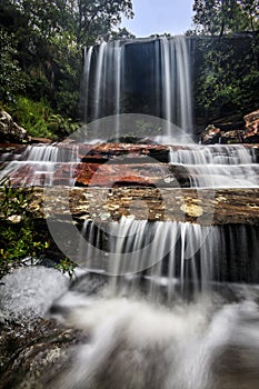 a large waterfall over some water at patonga