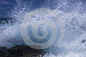 Large wave breaking on volcanic rock