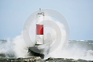 Large Wave Crashing into Breakwater Lighthouse