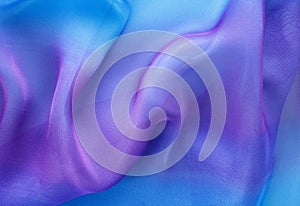 Large waves and curves on blue cloth background