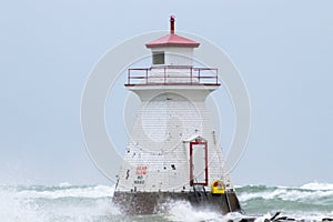 Large waves hitting the lighthouse at Southampton on Lake Huron