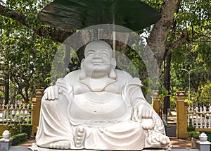 Large white Buddha statue at Giac Lam Pagoda in Saigon.