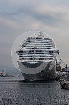 Large white cruise ship in the port of Savona, Italy