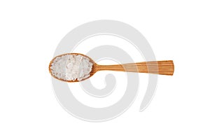 Large white crystals, Lemon salt in wooden spoon on white background, top view. Citric acid salt. Food additive E330. Design