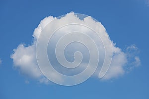 Large white cumulus cloud on the blue sky