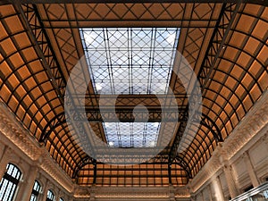 Large white glass canopy in a large station hall.