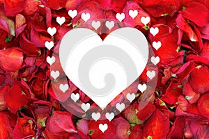 Large white heart surround with smaller hearts on dried rose petal background