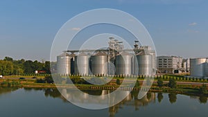 Large white industrial tanks for gasoline and oil. Butter tank at a refinery. Large manufacturing