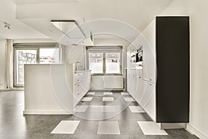 a large white kitchen with a checkered floor