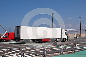 Large white lorry speeding from ferry