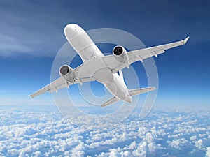 large white passenger plane flies high against backdrop of beautiful clouds on blue sky background