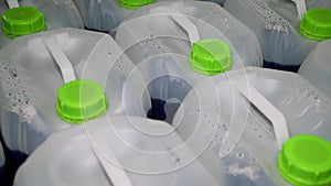 Large white plastic barrels on pallets at a chemical plant