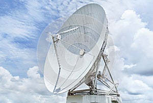 Large white satellite dishes in communication antenna center station