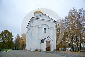A large white stone church with a golden dome and a bell in eastern Europe is a Christian orthodox for the prayers of God