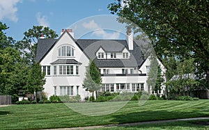 Large White Stucco Three Story House with Paned Windows