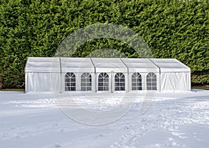 Large white tent marquee in the snow