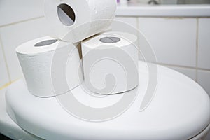 A large white toilet paper roll for use in bathrooms or kitchens, used for cleaning dirt in the bathroom background.