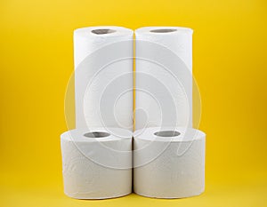 A large white toilet Paper roll for use in bathrooms or kitchens, used for cleaning dirt in the bathroom on yellow background