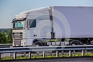 Large White Truck Semi Trailer Drives On A Country Highway