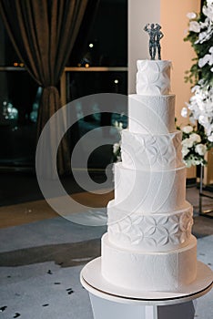 Large white wedding cake with castle shaped towers