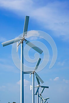 Large wind turbines are used to produc e electricity. Used as a clean energy and beautiful sky