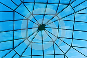 Large window in the roof of the hotel. Sky through a square window in the ceiling of the building