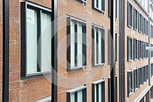 Large Windows in a red brick wall building