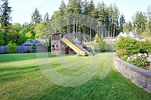 Large wood play ground for kids at back yard. photo