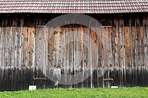 Large wooden barn doors with metal hinges