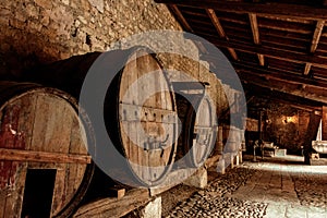 Large wooden barrels of wine.