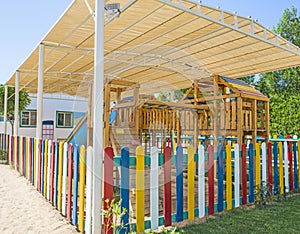 Large wooden climbing frame in children`s playground area