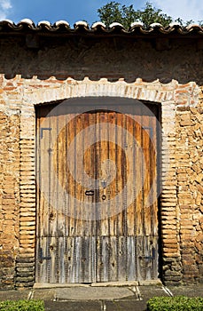 Large wooden door of old ranch house