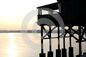 Large wooden stilt house on the seashore