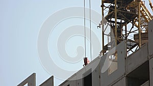 Large yellow construction crane above the building.