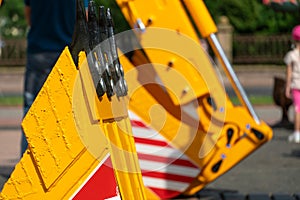 A large yellow construction excavator on a construction site. A new quarry bulldozer for the development of quarries at the