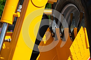 A large yellow construction excavator on a construction site. A new quarry bulldozer for the development of quarries at the