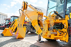 A large yellow construction excavator on a construction site. A new quarry bulldozer for the development of quarries at the