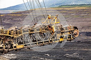Large yellow conveyor belt carrying. Mining of black coal in Czech Republic.
